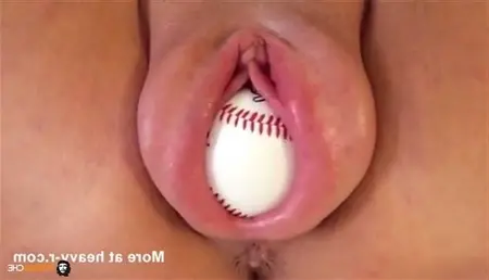 Bola de béisbol en coño